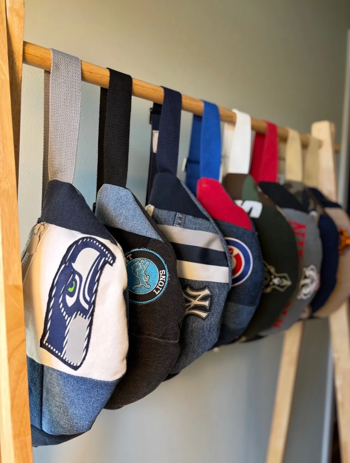 Hand-made Green Bay Packers and Denver Broncos fanny packs made from upcycled NFL fan gear