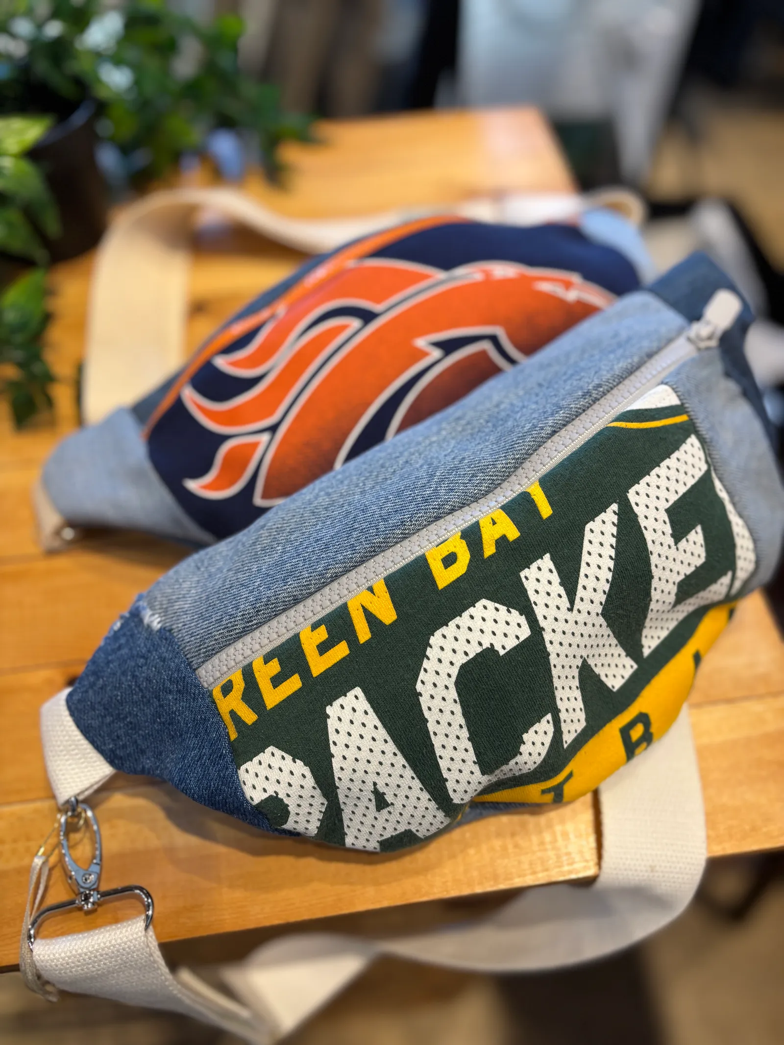 Hand-made Green Bay Packers and Denver Broncosfanny packs made from upcycled NFL jerseys and fan gear