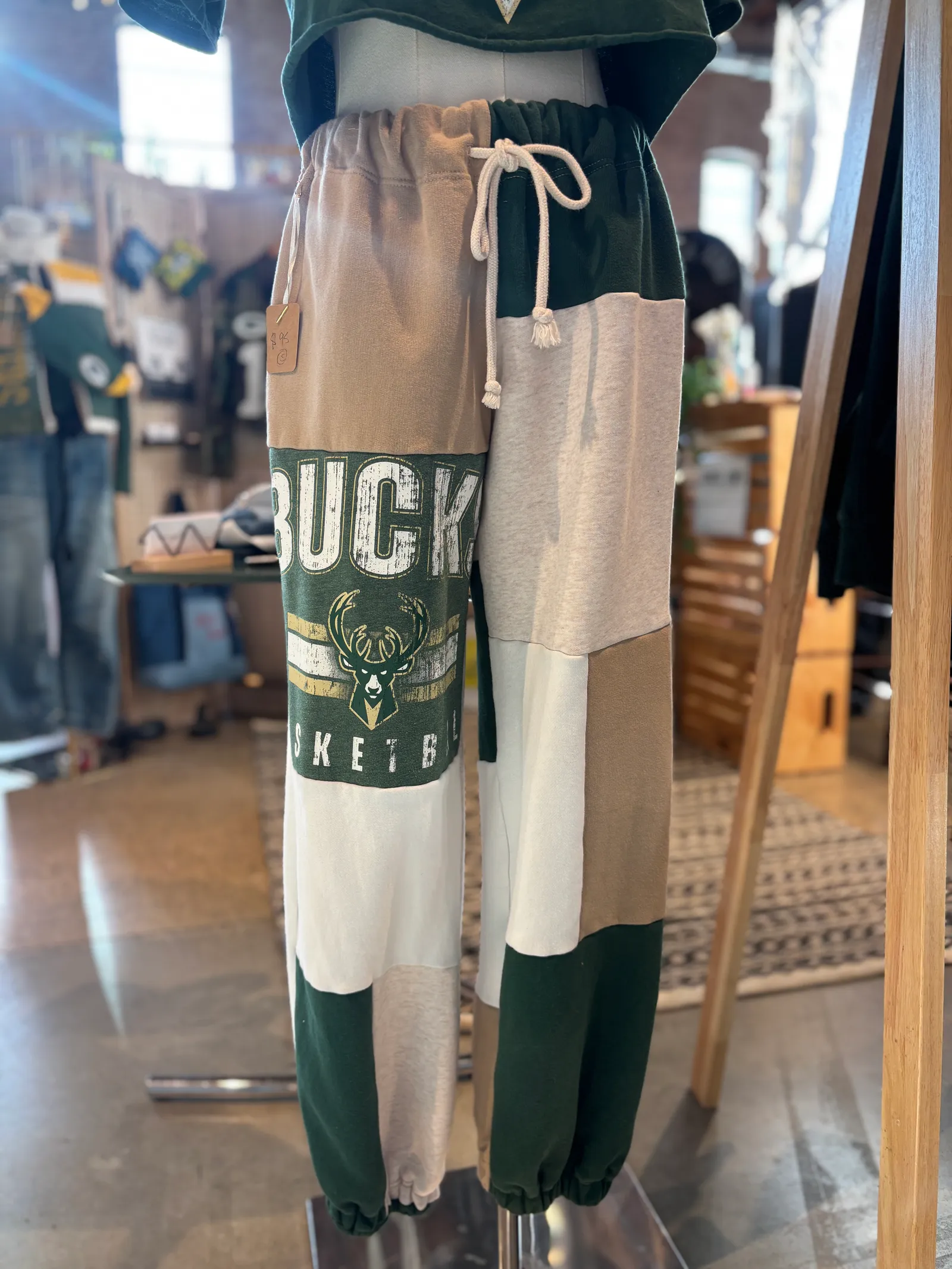 One-of-a-kind Milwaukee Bucks sweatpants made from upcycled fan gear